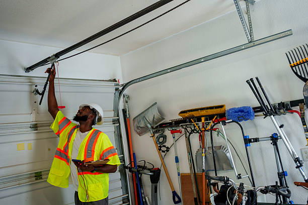 Professional Garage Door Installation technician working in Elwood, IN